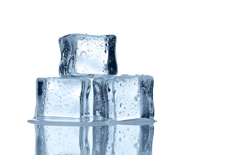 Melting ice cubes over white background with copy spaceの写真素材