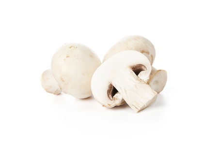 Fresh champignon mushrooms isolated on white backgroundの写真素材