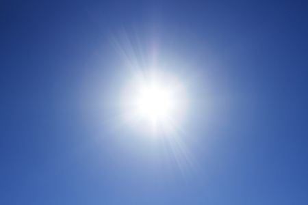 Sun at the clear blue skyの写真素材