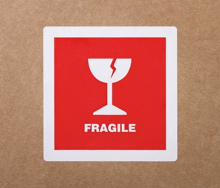 Fragile sticker at the cardboard packageの写真素材