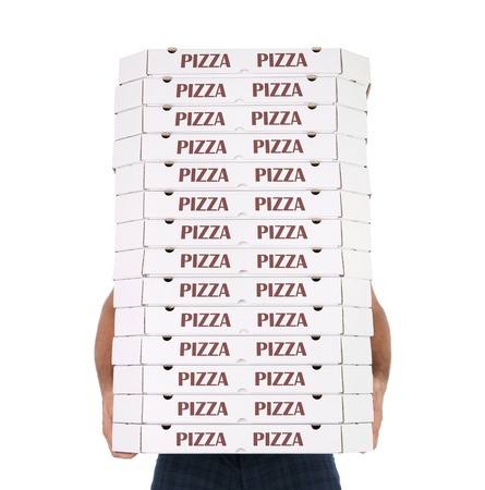 Funny pizza delivery boy with many pizza boxes isolated on white backgroundの写真素材