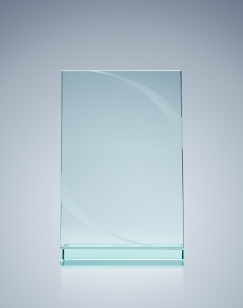 Blank glass award over gray background with copy spaceの写真素材