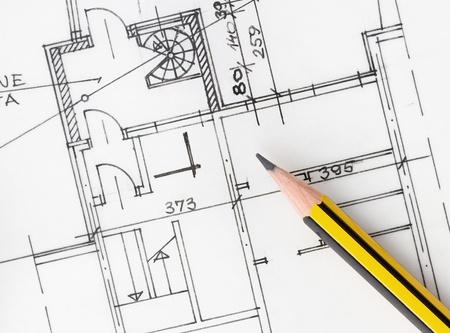 Yellow pencil over architectural plansのeditorial素材