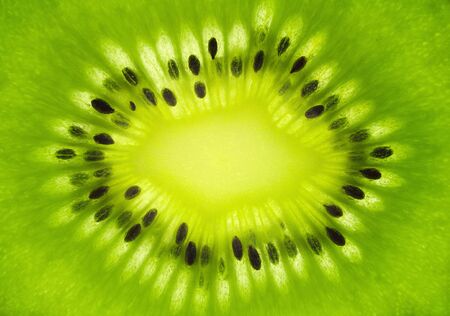Macro shot of fresh kiwi fruit cross sectionの写真素材