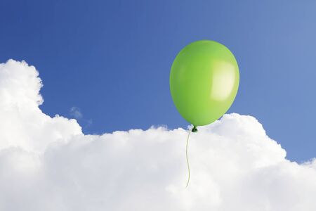 Green balloon in the sky with copy spaceの写真素材