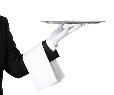 Waiter holding empty silver tray isolated on white background with copy spaceの写真素材