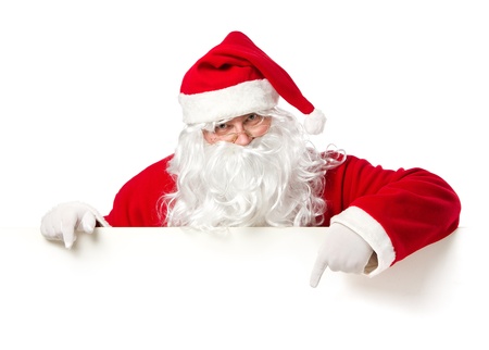 Santa Claus pointing in blank advertisement banner isolated on white background with copy spaceの写真素材