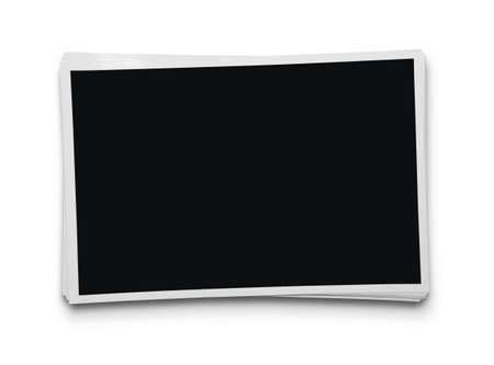 Stack of blank photographs isolated on white background with clipping path for the inside of the frameの写真素材