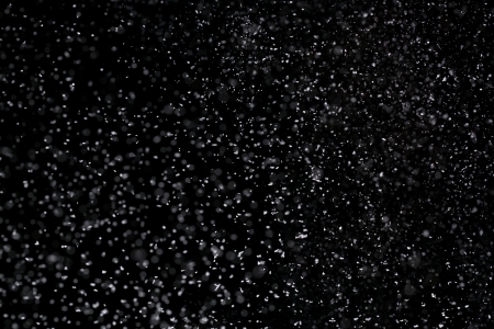 Winter background  Falling snow isolated on pure black backgroundの写真素材