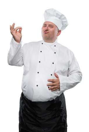 Funny overweight chef showing ok isolated on white backgroundの写真素材
