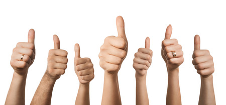 Close up of many hands showing thumbs up, isolated on white backgroundの写真素材
