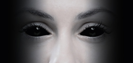 Close up of evil female eyesの写真素材