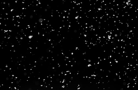 Winter background. falling snow isolated on black backgroundの写真素材