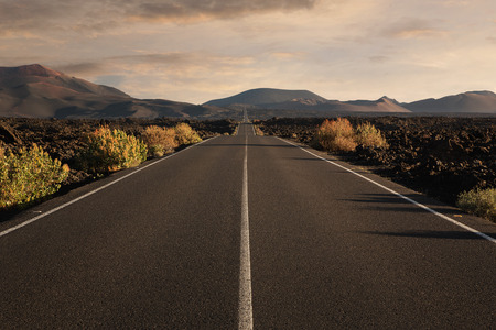Empty endless highway through the volcanic landscape with copy spaceの写真素材