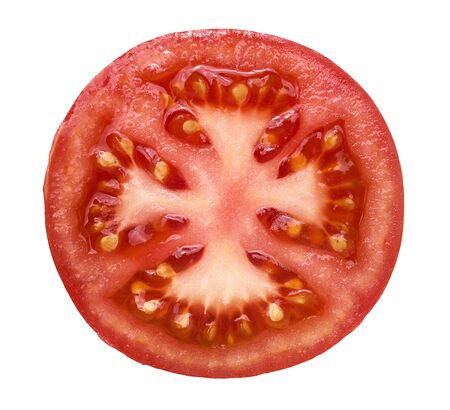 High angle view of slice of the fresh, juicy tomato isolated on white backgroundの写真素材