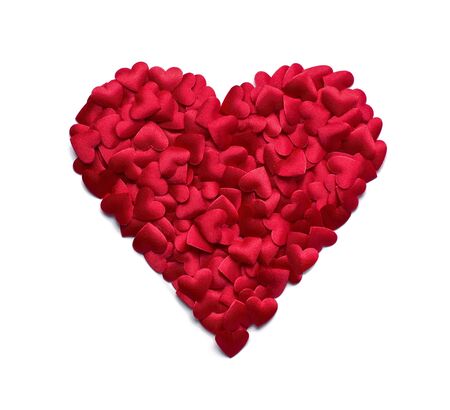 Red heart shape made of many small confetti hearts isolated on white backgroundの写真素材