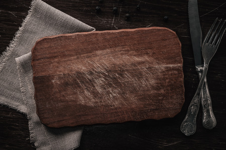 High angle view of empty cutting board on the table with copy spaceの写真素材