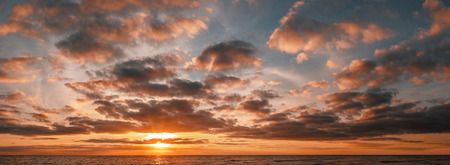 Panoramic shot of beautiful sunrise over the ocean with copy spaceの写真素材