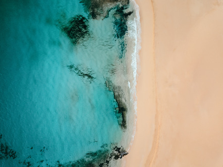 Aerial view of an empty tropical beach with copy space 