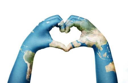 Close up of child hands, painted in the world map, formig heart shape isolated on white backgroundの写真素材