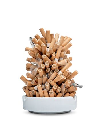 Ashtray full of cigarettes isolated on white background with copy spaceの写真素材
