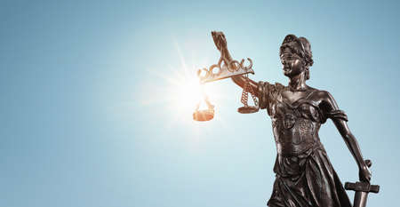 Lady justice, Themis sculpture over clear blue sky with copy space