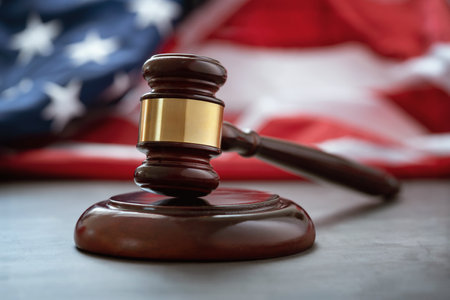 Close up of wooden judge gavel over the american flag with copy spaceの写真素材