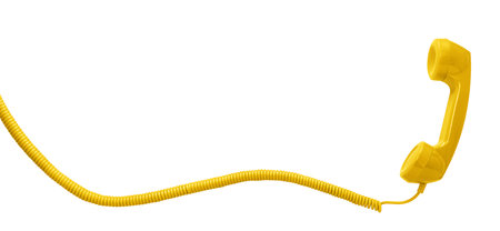 Yellow vintage telephone handset isolated on white background with copy spaceの写真素材