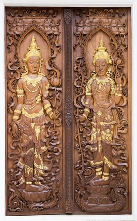 Carved wooden doors of the temple in Thailand.の写真素材