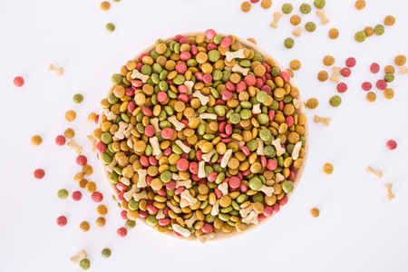 Dog food pellets on a white background.の写真素材