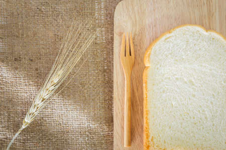 slice of bread on sackcloth background.の写真素材