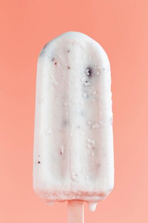 Black bean ice cream on a pink background