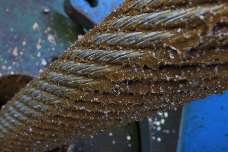 Thick steel cable with grease