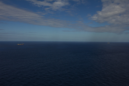 Area of work offshore on the high seas, the oil industry and a beautiful day and sunsetの写真素材