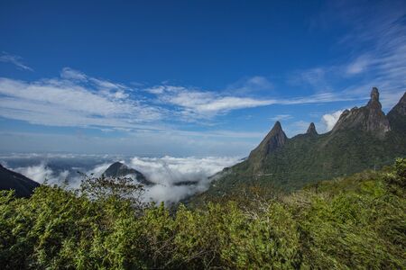 Stunning scenery at sunset in the Brazilian mountains with clouds covering the valley below.