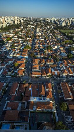 Roofs different from houses. View of the different red roofs of houses.の写真素材