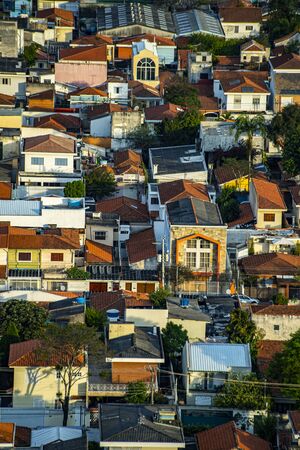 Roofs different from houses. View of the different red roofs of houses.の写真素材