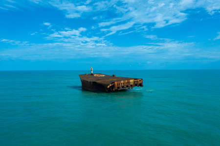 Abandoned ship. Ocean pollution. Fortaleza city, State of CearÃ¡, Brazil.の写真素材