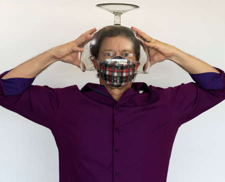 Healthcare, pain, coronavirus concept. A sick man in a protective mask. A man under a glass.の写真素材