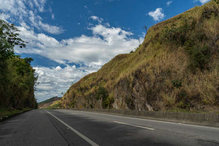 Driving between rocks. Beautiful Country roads and nature.の写真素材