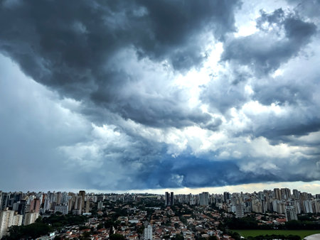 Dark and dramatic rain clouds over a city. Sao Paulo city, Brazil.の写真素材