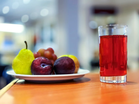 A Plate of fruit on the table with a blurred background.の写真素材
