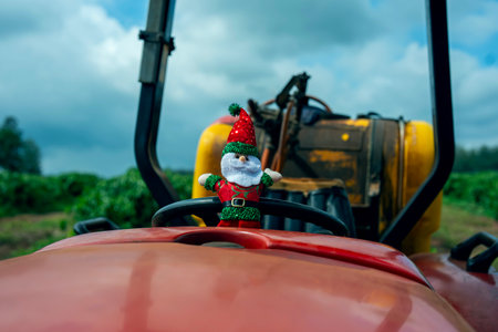Santa Claus on a tractor in farming. Christmas and New Year concept.の写真素材