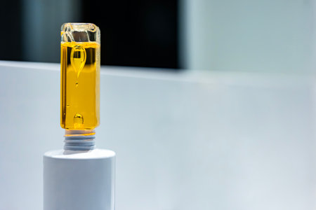 Drops inside a plastic bottle. Beautiful drops inside a yellow liquid.の写真素材