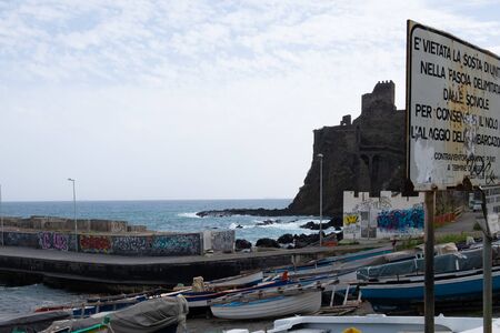 Sicily, Italy - January 17, 2016: A serene scene of the bay and the castle in Aci Castello.のeditorial素材