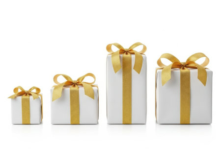 Four gift boxes of varying sizes, wrapped in white paper with gold ribbons and bows, arranged in a row.の素材