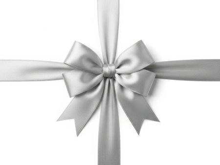 A beautifully crafted silver ribbon bow tied in a neat knot, set against a pristine white background, creating a sense of sophistication and elegance.の素材