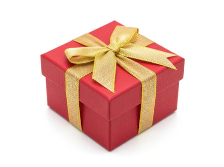 A beautifully wrapped red gift box adorned with a golden ribbon bow, sitting against a plain white background.の素材