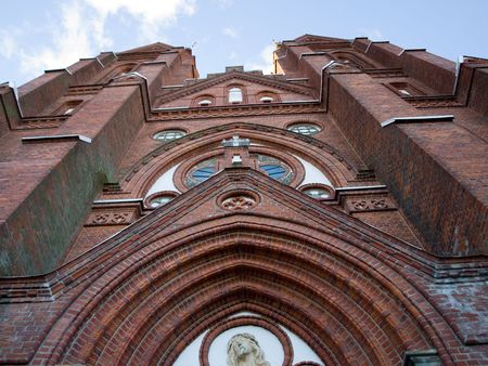 Red brick church reaching skywardsの写真素材