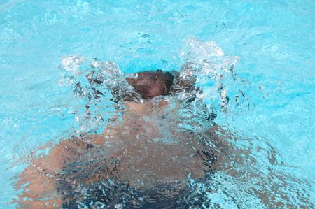 Diving woman coming up for airの写真素材